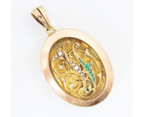 A 19th century emerald and seed pearl set locket/pendant, the oval locket with relief detailed initial monogram set with seed