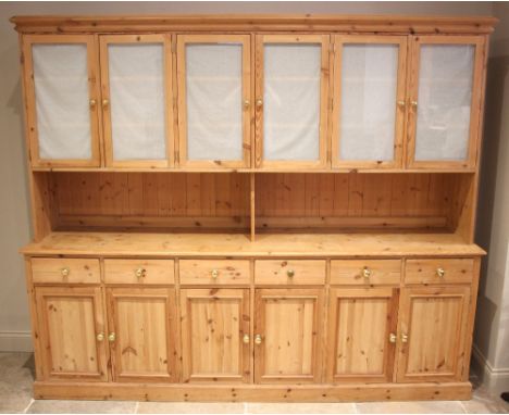 A large Victorian style pine dresser/housekeepers cupboard, late 20th century, the moulded cornice over six glazed cupboard d