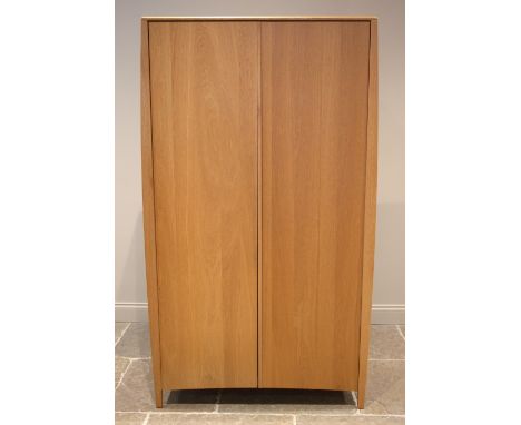 An Ercol Savona light oak two door wardrobe, late 20th/early 21st century, opening to an internal mirror, a single shelf over