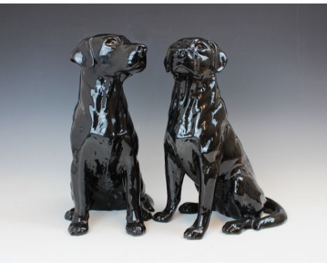 Two Beswick Fireside series models of Black Labradors, model no. 2314, modelled seated, printed and impressed maker's mark an