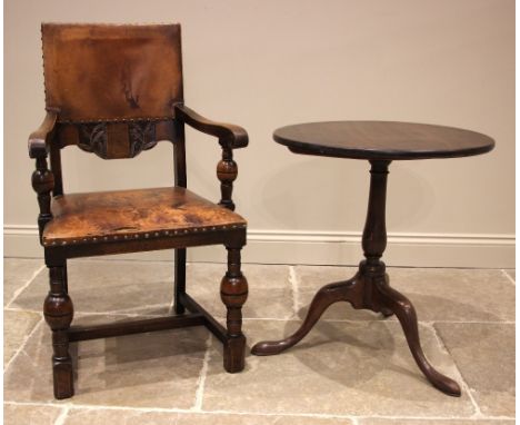 A 17th style oak elbow chair, early 20th century, the leather back rest with peripheral stud detail above the conforming seat
