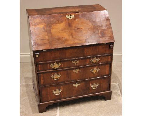A William and Mary yew and elm 'patchwork' veneered bureau, early 18th century, the waterfall interior comprising pigeon hole