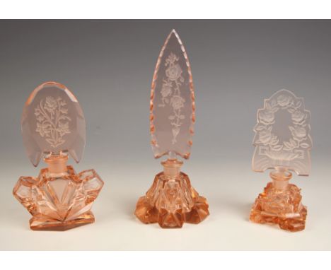 A rose glass scent bottle, early 20th century, spearhead shaped stopper decorated with reverse relief cut floral motif with t