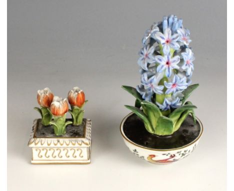 A porcelain model of a hyacinth, 20th century, set to a bowl decorated with exotic birds in the manner James Giles, applied T