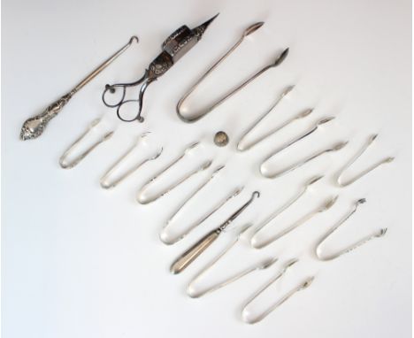 A collection of various silver and silver coloured sugar tongs, including a Victorian example, Charles Edwards, London 1886, 