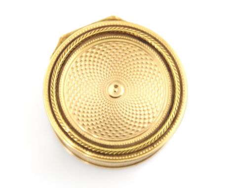A 20th century gold coloured vinaigrette, the circular hinged cover with concentric engine turned detail, opening to reveal p