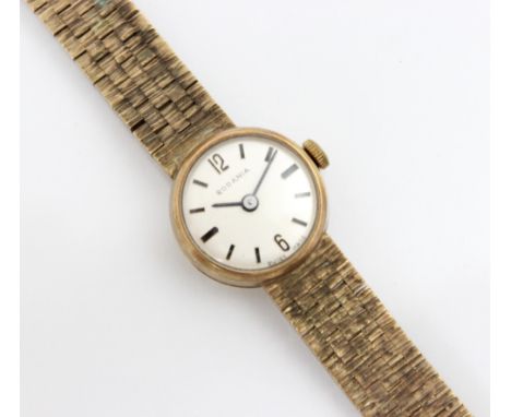 A 9ct yellow gold ladies 'Rodina' wrist watch, the circular cream dial with baton makers and Arabic numerals within plain pol