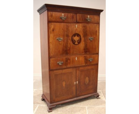 A continental walnut, mahogany and marquetry secretaire abattant, early 19th century, the dentil cornice over a pair of friez