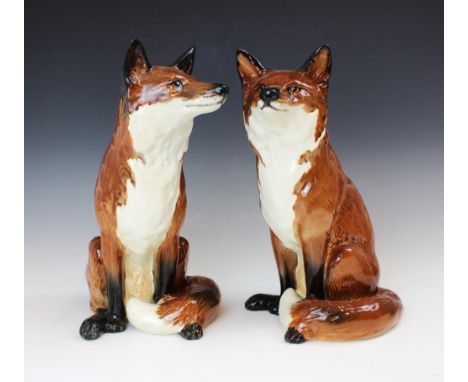 Two Beswick Fireside series models of Foxes, model no. 2348, each modelled seated, printed maker's mark, model number to base