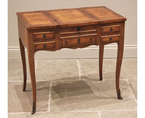 A French Louis XV style kingwood and marquetry ladies dressing table, late 19th/early 20th century, the shaped top formed fro