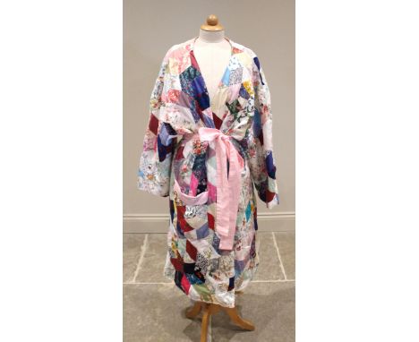 A 20th century patchwork three-quarter length jacket, the exterior with multiple patch work panels depicting printed patterns