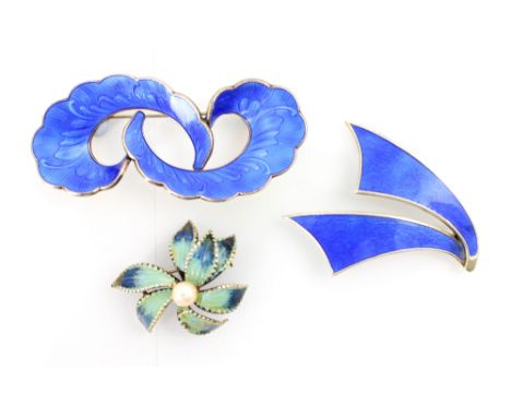 An enamel and silver brooch by Ivar T Holth, the stylised double swirl with applied blue guilloche enamel, hinge pin to rever