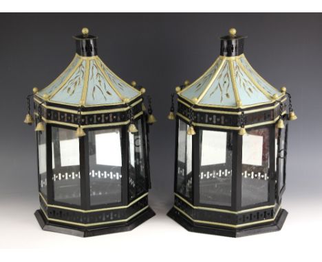 A pair of toleware wall mounting lanterns, 20th century, the pagoda shaped tops suspending bells above five single glazed pan