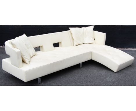 A contemporary Italian cream leather corner sofa by Formenti, late 20th century, of 'L' shape with a padded and arcaded back 