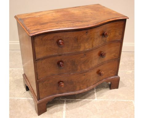 A 19th century serpentine mahogany chest of drawers, the moulded top over an arrangement of three long cock-beaded drawers, a