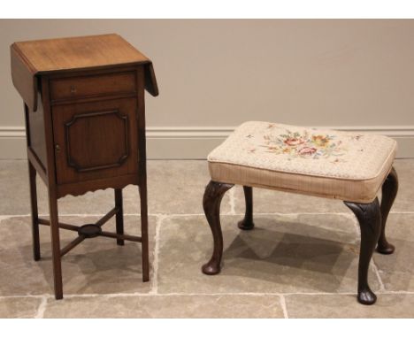 A George II influence dressing stool, 19th century and later, the tapestry seat upon leaf moulded walnut cabriole legs culmin