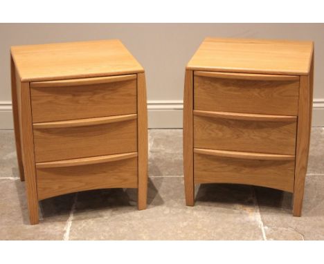 A pair of Ercol Savona light oak bedside cabinets, late 20th/early 21st century, each formed with drawers upon tapering squar