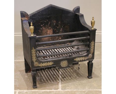 An Adam style cast iron fire basket, the architectural shaped back panel, over a pair of brass urn finials and a straight rai