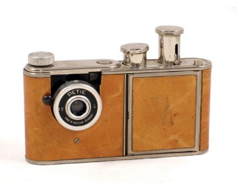 Petie Vanity Outfit. Pig skin covering, (condition 5/6F). Camera working, complete with spools.[cabinet N]