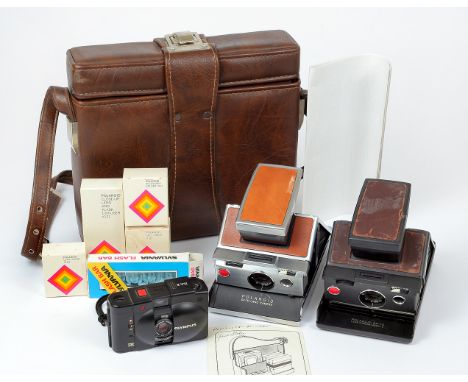 Two Polaroid SX-70 Instant Print Cameras. One light brown and a dark brown Model 2, both show signs of use, but working, a Po