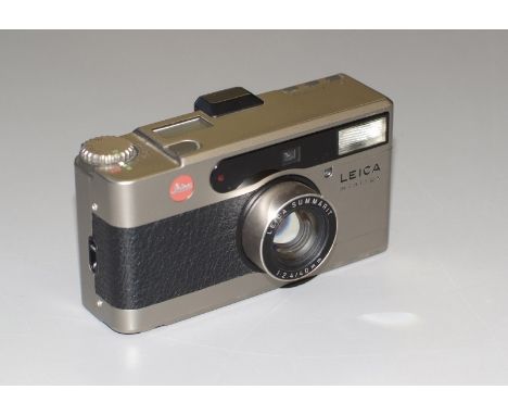 Leica Minilux 35mm Compact Camera. 2073897 (slight wear to rear and front, lower edge, otherwise condition 5F) with Leica Sum