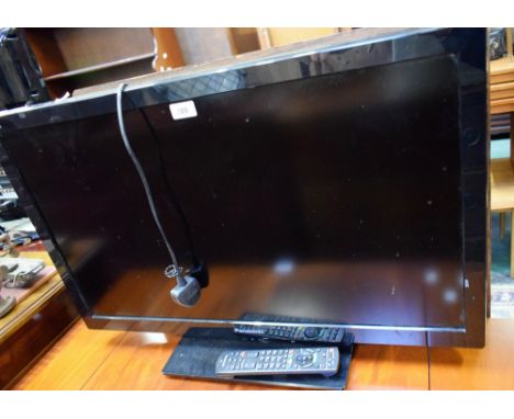 A Panasonic Model TX-L32C4B TV and remote.