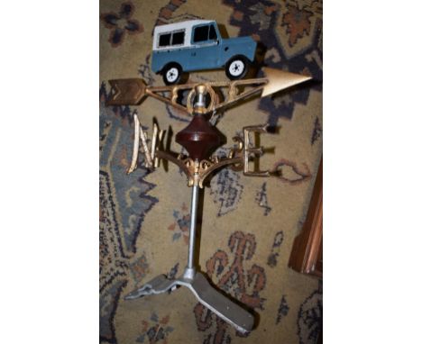 A reproduction cast iron Land Rover weather vane and mount 