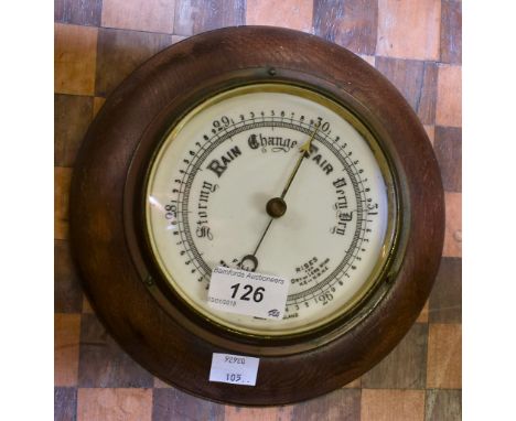 An oak cased circular barometer