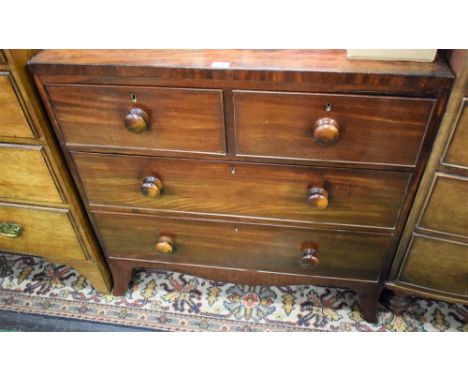 A Victorian mahogany chest, caddy top, two short cockbeaded drawers over two graduated long, turned handles, spreading bracke