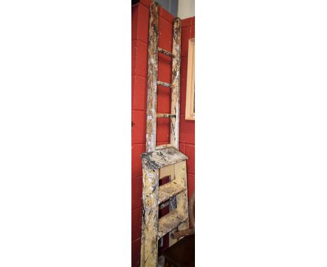A vintage five tread step ladder; a vintage wooden ladder. (2)
