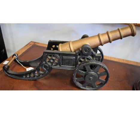 A reproduction cast metal model canon