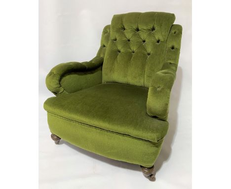 Green velvet button upholstered easy chair with turned legs and ceramic castors