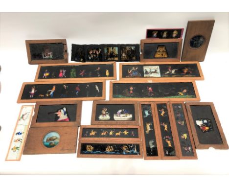 A good collection of 19th century Magic Lantern slides, including a set of five multi-image slides in mahogany frames stamped