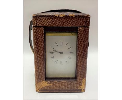 A carriage clock, the 2.5 inch white enamel dial with black roman numerals, the French movement striking on a gong and with J