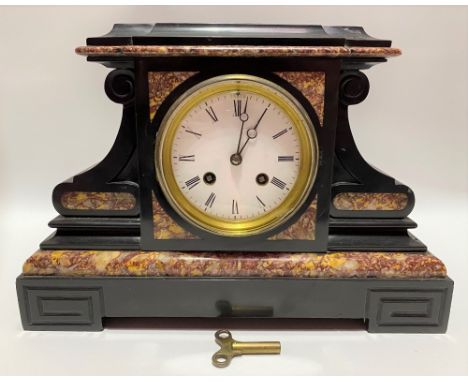 A black and red veined two train clock garniture, the 3.5 inch white enamel dial with roman numerals, the French movement str