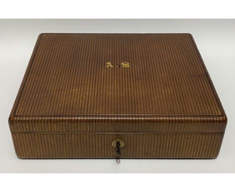 An Edwardian tooled leather writing box by W. Leuchars, maker, 38, Piccadilly, London, the brown tooled leather outer case wi