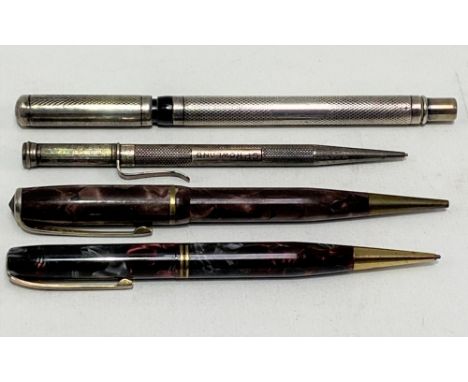 George V silver engine turned fountain pen with 14ct gold nib, hallmarked London 1919 (maker's mark work); together with a si