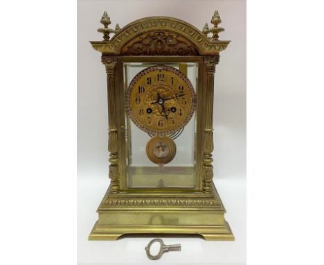 A good French brass four glass two train clock by J. Marti &amp; Cie, the 3.5 inch brass dial with black painted Arabic numer