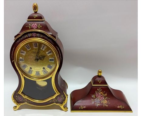 A modern French style two train bracket clock with red foliate painted case, the five inch brass dial with white and black en