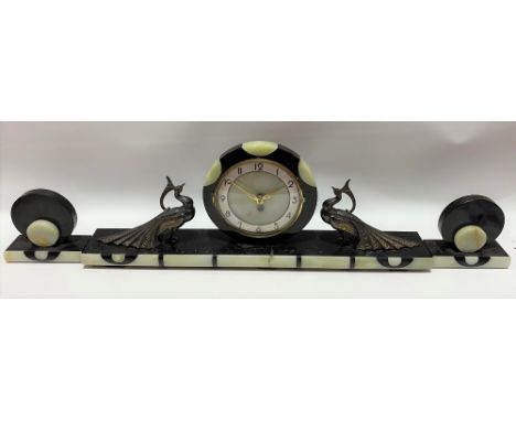 Art Deco black marble and green onyx clock garniture, the 5.5in dial with gilt Arabic Numerals and with a German movement wit