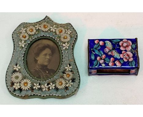 Micro-mosaic photograph frame decorated with daisies on a blue ground, with oval aperture and lacquered brass back, aperture 