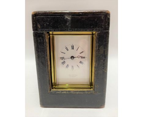 A brass cased carriage clock, the 2.5 inch white enamel dial with black Roman numerals and signed 'RAINFORTH BRIDGWATER', the