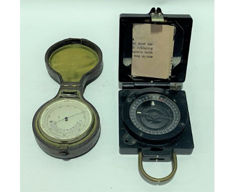 Nickel cased aneroid pocket barometer thermometer with original Moroccan leather case; together with a military issue compass