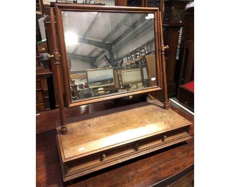 A mahogany swing toilet mirror, the rectangular plate over a stand with two frieze drawers, one stamped Hindley &amp; Wilkins