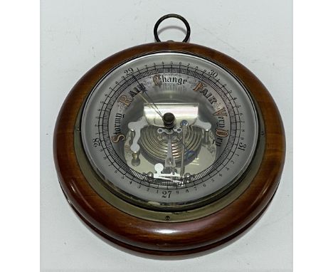 A walnut cased aneroid barometer, diameter 18cm