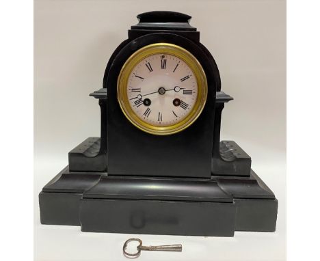 A black marble cased two train mantle clock, the 3.5 inch white enamel dial with black roman numerals, the French movement st