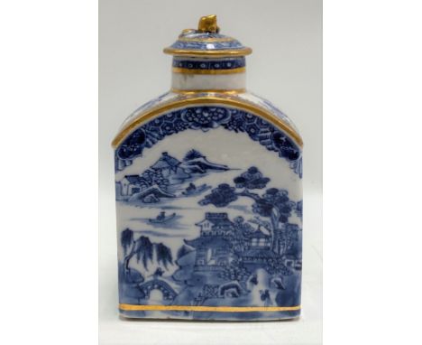 A Chinese export blue and white underglaze tea caddy, underglaze printed with a continuous pagoda and lake landscape and with