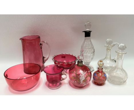 Five Victorian cranberry glass items, including two enamel decorated scent bottles and stoppers; together with three cut glas