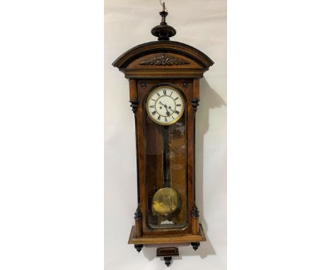 A 19th Century walnut cased two-train Vienna wall clock, with 6.5in white enamel dial with black Roman Numerals and with arch