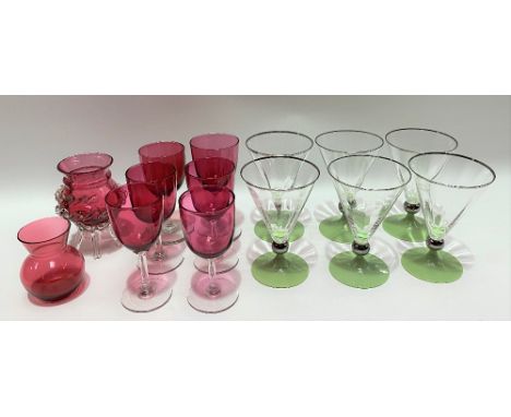 Set of five Victorian cranberry glass wine glasses, one other wine glass and two vases; together with a set of six Art Deco p